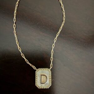TAI D letter necklace with pearl background